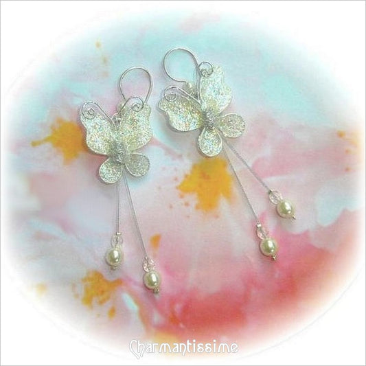 Boucles d'oreilles mariage papillons ivoires et perles cristal nacrées ivoires sur crochets argent