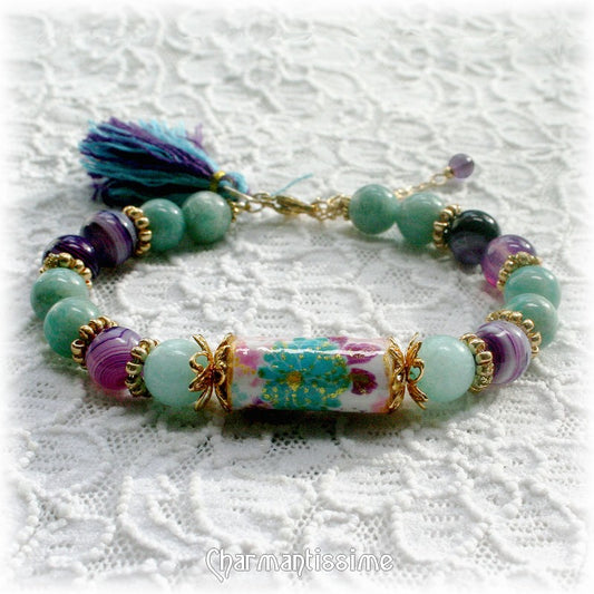 bracelet style japonais avec fleur et pompon violet, bleu turquoise et or de la marque Charmantissime